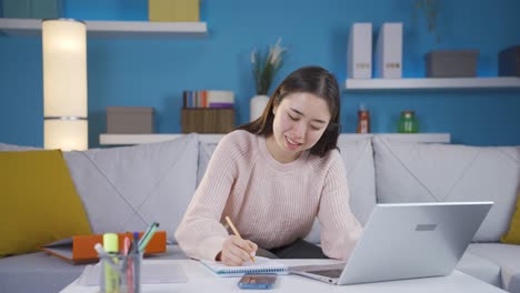 Asian-Young-Woman-Successful-And-Hardworking-In-Her-Home-Office.